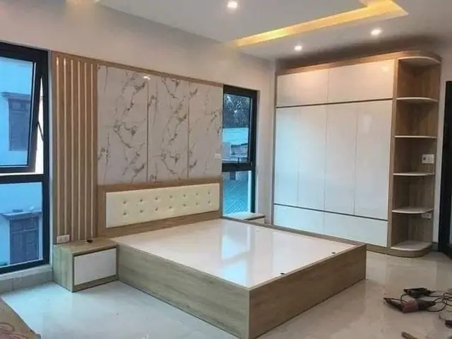 Bed with wardrobe and wall panelling – Bed by Varnika Furnitures and Aluminium Works, Lucknow