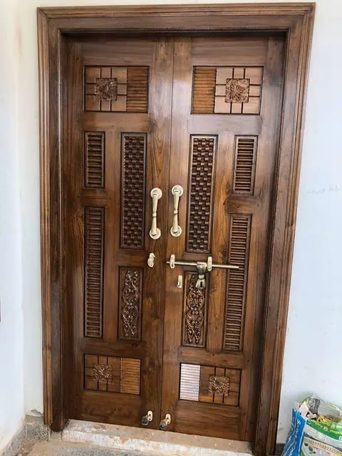 Carved teak double door with brass handles – Dual Door Gate by Varnika Furnitures and Aluminium Works, Lucknow
