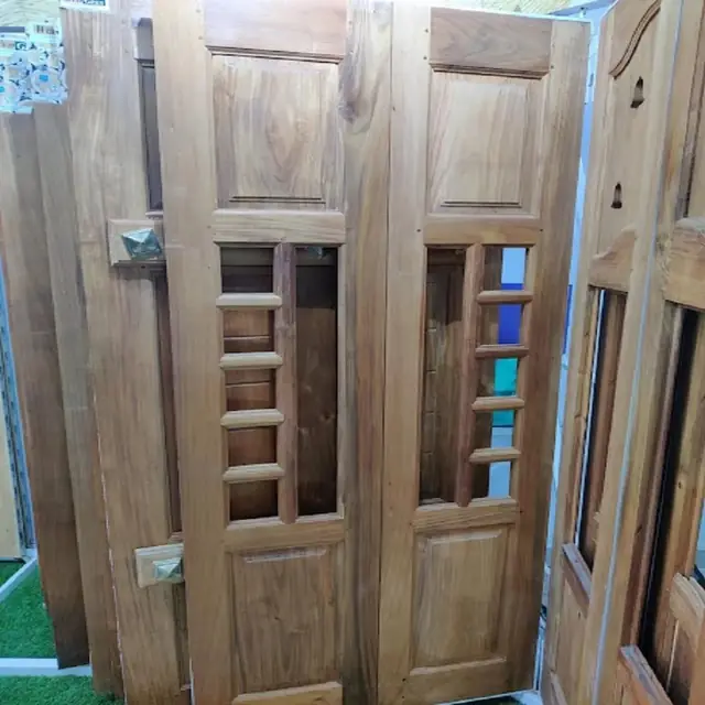 Solid wood double doors with jaali windows – Dual Door Gate by Varnika Furnitures and Aluminium Works, Lucknow