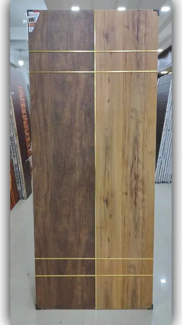 Wood-grain flush door with brass strips – Single Door Gate by Varnika Furnitures and Aluminium Works, Lucknow