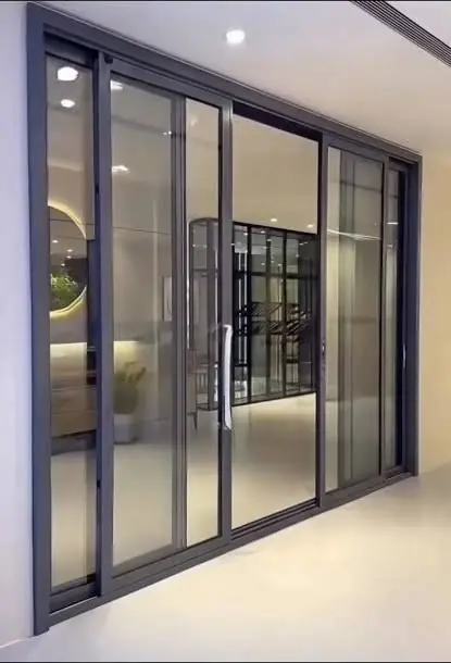 Black aluminium glass sliding door – Sliding Door by Varnika Furnitures and Aluminium Works, Lucknow