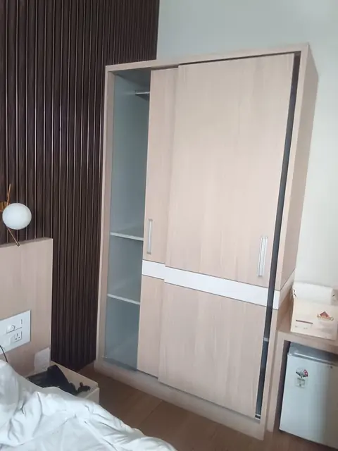 Sliding-shutter wardrobe in light oak – Sliding Door by Varnika Furnitures and Aluminium Works, Lucknow