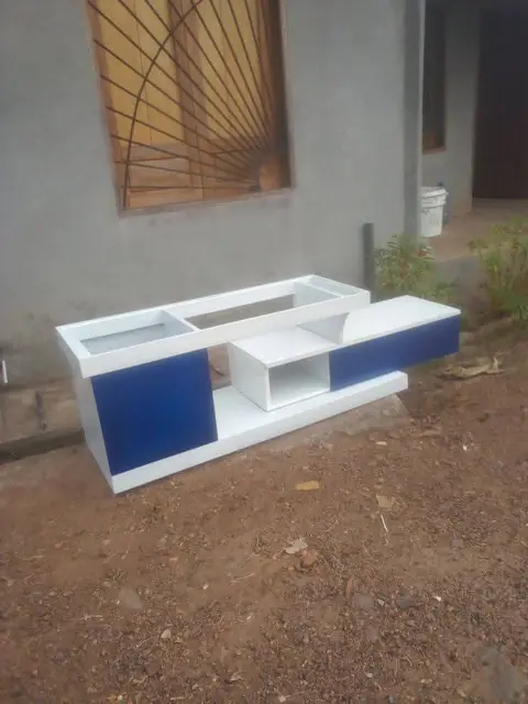 Blue and white TV console – TV Unit by Varnika Furnitures and Aluminium Works, Lucknow