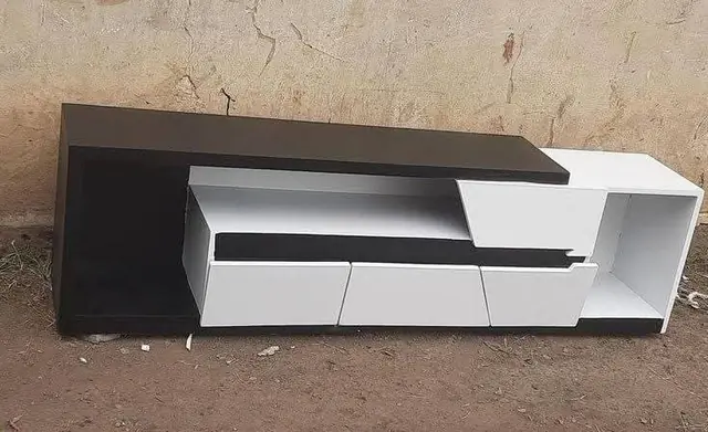 Black and white TV console – TV Unit by Varnika Furnitures and Aluminium Works, Lucknow