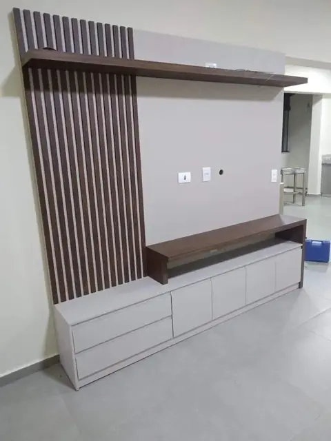 Wall-mounted TV unit with louvers – TV Unit by Varnika Furnitures and Aluminium Works, Lucknow